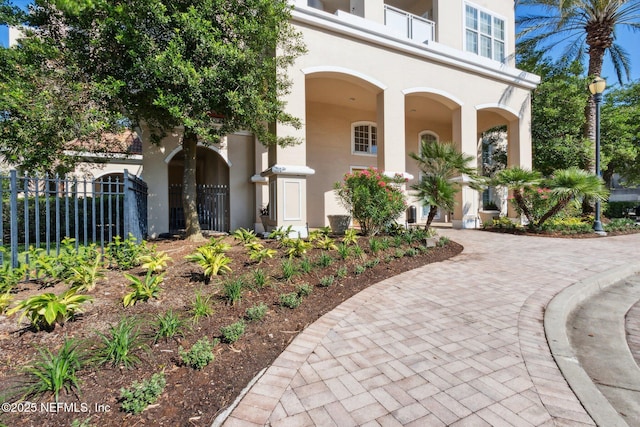 400 E Bay St Unit 401, Jacksonville, FL 32202 - view of exterior entry featuring stucco siding and covered porch