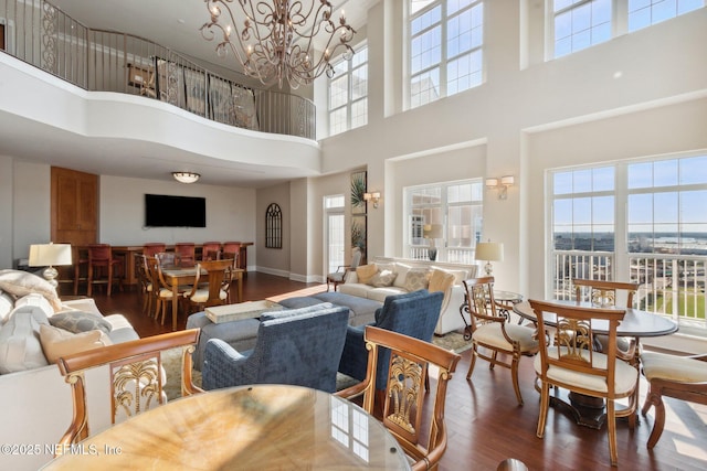 400 E Bay St Unit 401, Jacksonville, FL 32202 - living room with a towering ceiling, wood finished floors, and a chandelier