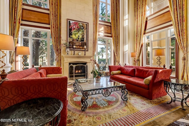 400 E Bay St Unit 401, Jacksonville, FL 32202 - living area featuring a high ceiling and a lit fireplace