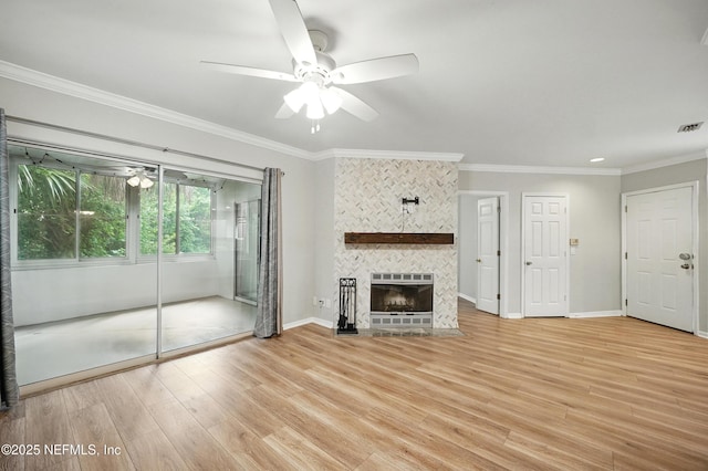 1800 The Greens Way Unit 603, Jacksonville Beach, FL 32250 - unfurnished living room with ceiling fan, light wood-style floors, ornamental molding, and a tiled fireplace