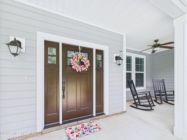 96168 High Pointe Dr, Fernandina Beach, FL 32034 - view of exterior entry featuring a porch and a ceiling fan