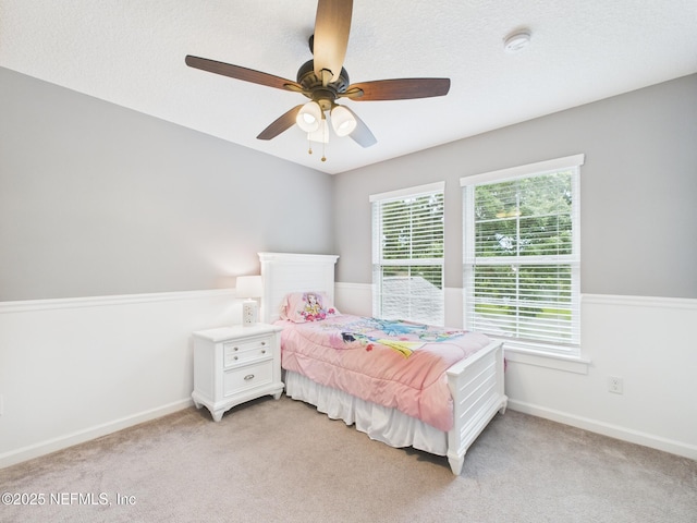 96168 High Pointe Dr, Fernandina Beach, FL 32034 - bedroom featuring light colored carpet and ceiling fan