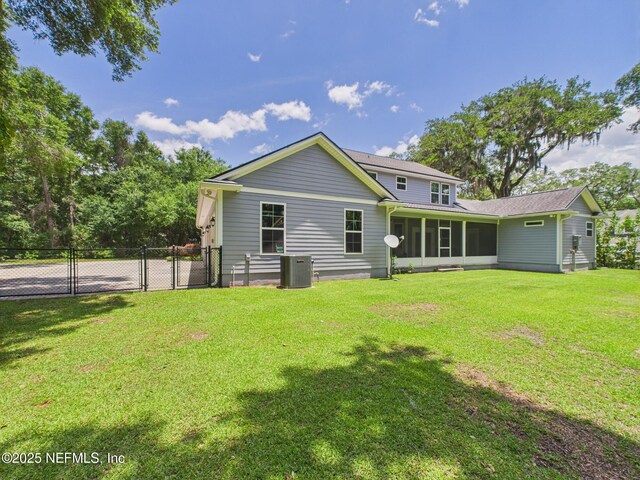 96168 High Pointe Dr, Fernandina Beach, FL 32034 - rear view of property with a sunroom and a gate