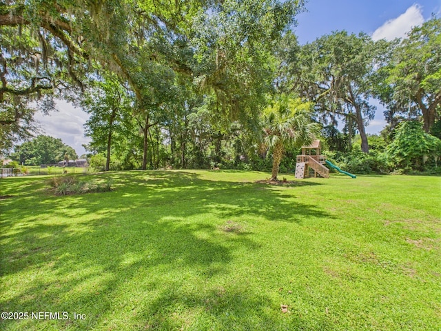 96168 High Pointe Dr, Fernandina Beach, FL 32034 - view of green lawn featuring a playground