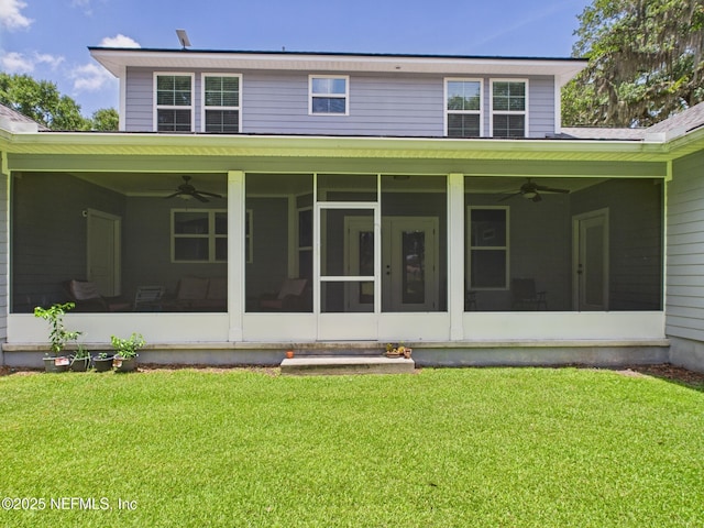 96168 High Pointe Dr, Fernandina Beach, FL 32034 - rear view of house featuring a ceiling fan, a sunroom, and a lawn