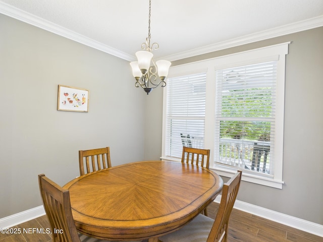 96168 High Pointe Dr, Fernandina Beach, FL 32034 - dining room featuring a chandelier, crown molding, and dark wood-style flooring