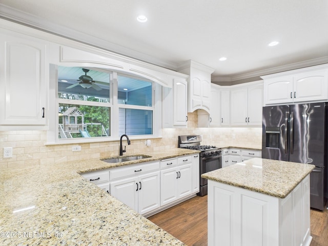 96168 High Pointe Dr, Fernandina Beach, FL 32034 - kitchen featuring appliances with stainless steel finishes, white cabinets, ornamental molding, and recessed lighting