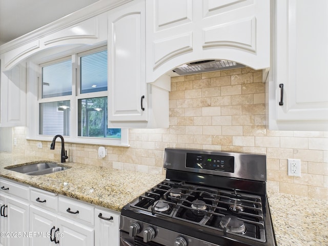 96168 High Pointe Dr, Fernandina Beach, FL 32034 - kitchen featuring range with gas cooktop, backsplash, and white cabinetry