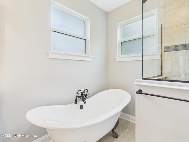 96168 High Pointe Dr, Fernandina Beach, FL 32034 - bathroom featuring a soaking tub and tile patterned floors