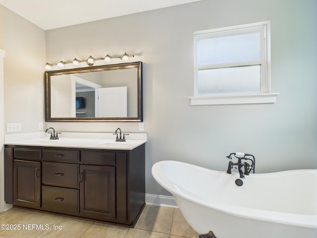 96168 High Pointe Dr, Fernandina Beach, FL 32034 - full bathroom with double vanity, tile patterned flooring, and a freestanding bath
