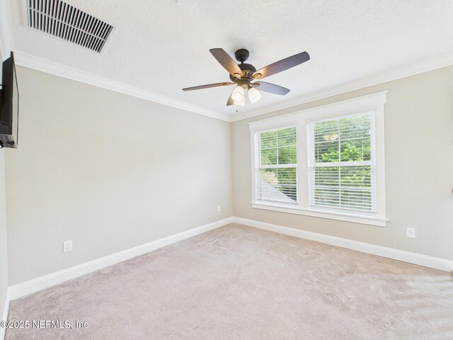 96168 High Pointe Dr, Fernandina Beach, FL 32034 - spare room with light colored carpet, ornamental molding, and a ceiling fan