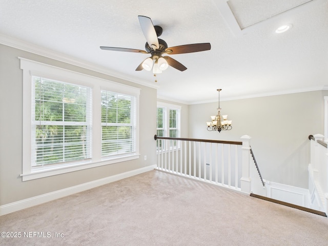 96168 High Pointe Dr, Fernandina Beach, FL 32034 - carpeted spare room with crown molding, a chandelier, and a ceiling fan