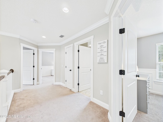 96168 High Pointe Dr, Fernandina Beach, FL 32034 - corridor featuring light colored carpet, an upstairs landing, ornamental molding, and recessed lighting