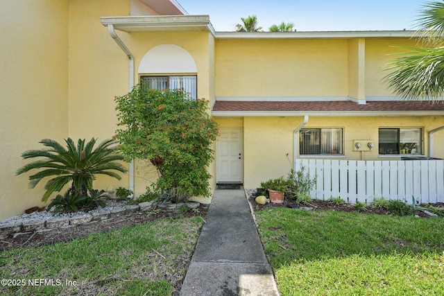 3960 A1A S Unit 505, Saint Augustine Beach, FL 32080 - view of front of house featuring stucco siding and a front yard