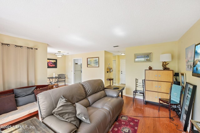3960 A1A S Unit 505, Saint Augustine Beach, FL 32080 - living area with wood finished floors and baseboards