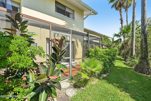3960 A1A S Unit 505, Saint Augustine Beach, FL 32080 - view of side of home with stucco siding and a yard