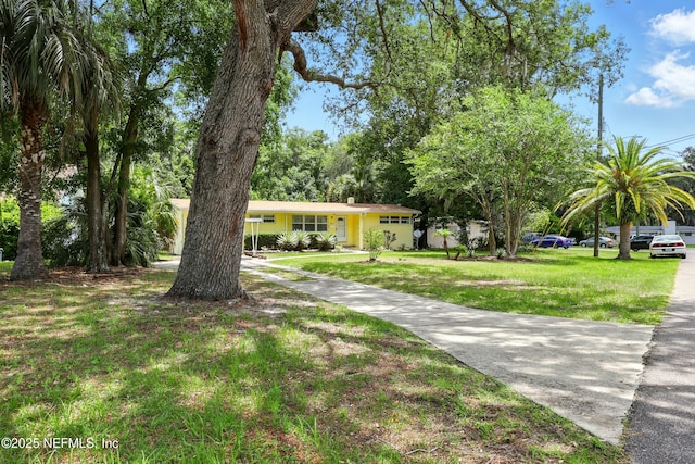 1206 Nightingale Ct, Jacksonville, FL 32216 - ranch-style home with a front yard