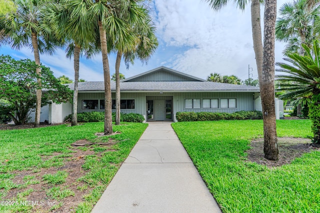 9360 Craven Rd Unit 703, Jacksonville, FL 32257 - ranch-style home featuring a front lawn and a shingled roof