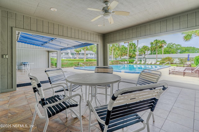 9360 Craven Rd Unit 703, Jacksonville, FL 32257 - view of patio featuring ceiling fan and a community pool