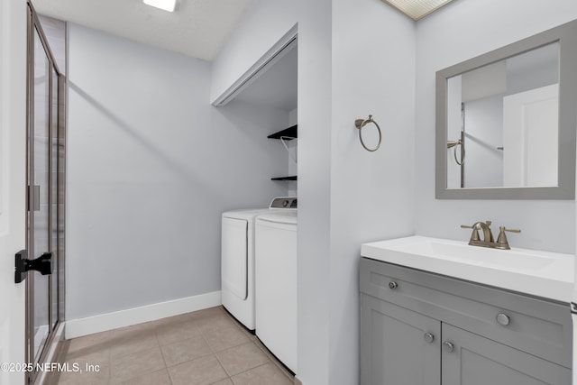 9360 Craven Rd Unit 703, Jacksonville, FL 32257 - washroom with washer and dryer and light tile patterned floors