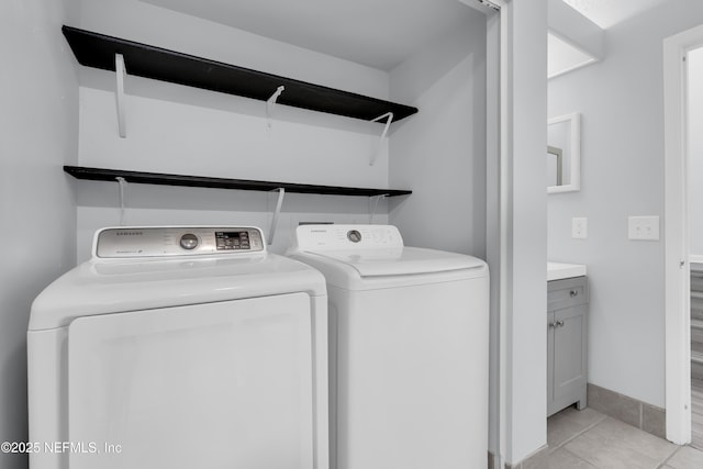 9360 Craven Rd Unit 703, Jacksonville, FL 32257 - laundry area with independent washer and dryer and light tile patterned flooring