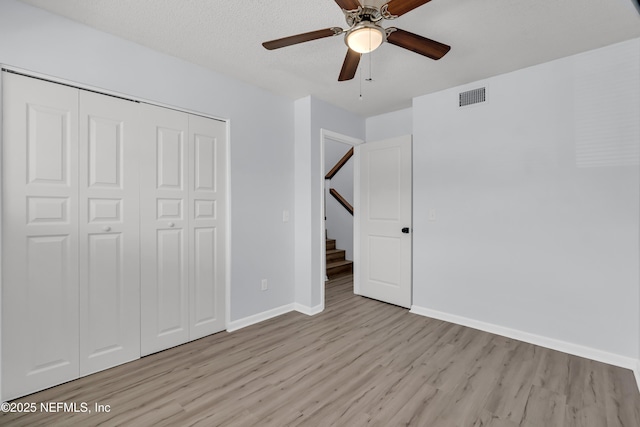 9360 Craven Rd Unit 703, Jacksonville, FL 32257 - unfurnished bedroom featuring light wood finished floors, a closet, and a ceiling fan