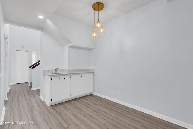 9360 Craven Rd Unit 703, Jacksonville, FL 32257 - unfurnished dining area with light wood-type flooring, recessed lighting, and a textured ceiling
