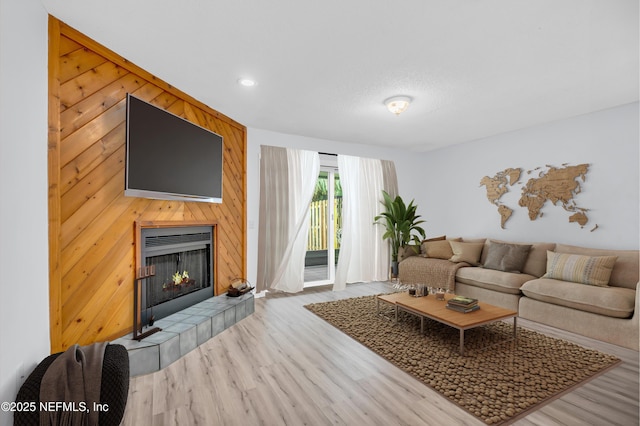 9360 Craven Rd Unit 703, Jacksonville, FL 32257 - living room featuring wood finished floors, a tile fireplace, and recessed lighting
