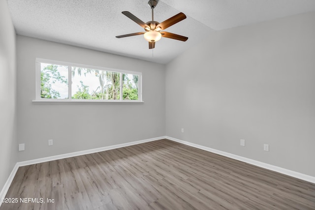 9360 Craven Rd Unit 703, Jacksonville, FL 32257 - empty room featuring wood finished floors, a ceiling fan, and lofted ceiling