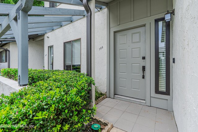 9360 Craven Rd Unit 703, Jacksonville, FL 32257 - entrance to property with stucco siding and board and batten siding