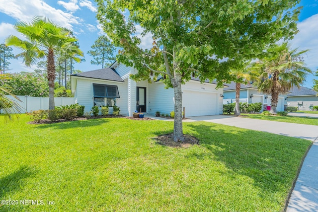97082 Harbor Concourse Cir, Fernandina Beach, FL 32034 - obstructed view of property with driveway and a garage