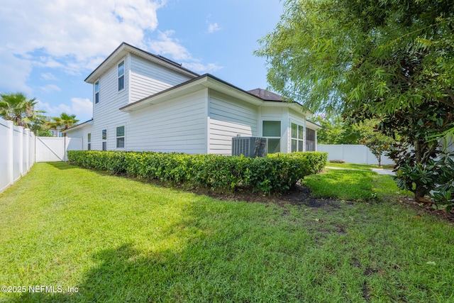 97082 Harbor Concourse Cir, Fernandina Beach, FL 32034 - view of side of home featuring a fenced backyard and a central AC unit