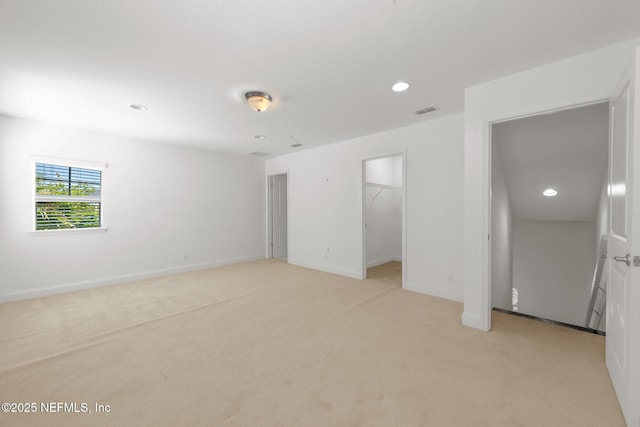 97082 Harbor Concourse Cir, Fernandina Beach, FL 32034 - unfurnished bedroom with light carpet, recessed lighting, and a spacious closet