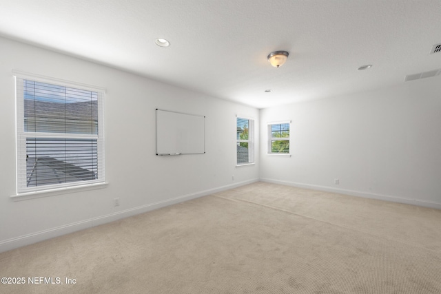97082 Harbor Concourse Cir, Fernandina Beach, FL 32034 - unfurnished room featuring light colored carpet and recessed lighting