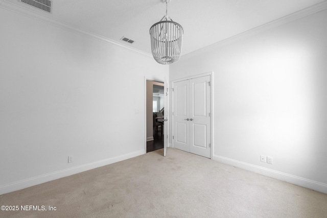 97082 Harbor Concourse Cir, Fernandina Beach, FL 32034 - unfurnished dining area with a chandelier, crown molding, and carpet