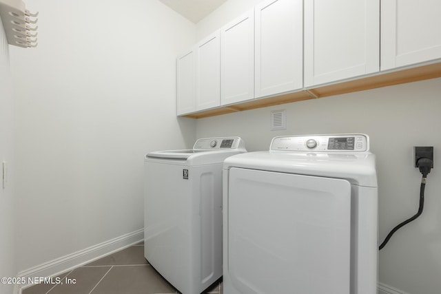 97082 Harbor Concourse Cir, Fernandina Beach, FL 32034 - laundry area with cabinet space, separate washer and dryer, and tile patterned flooring