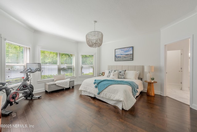 97082 Harbor Concourse Cir, Fernandina Beach, FL 32034 - bedroom featuring a chandelier, dark wood finished floors, and ornamental molding