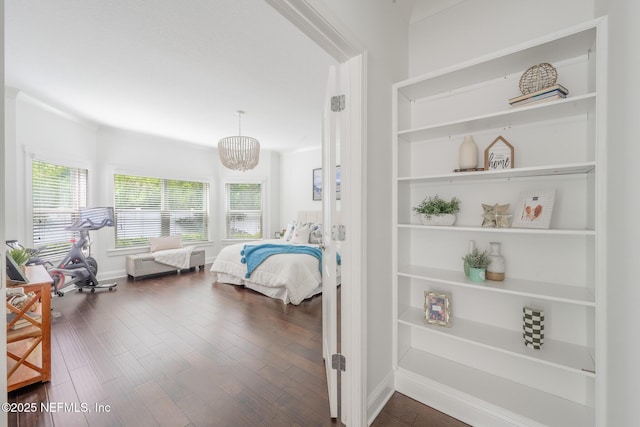97082 Harbor Concourse Cir, Fernandina Beach, FL 32034 - bedroom featuring multiple windows, dark wood-type flooring, and a chandelier