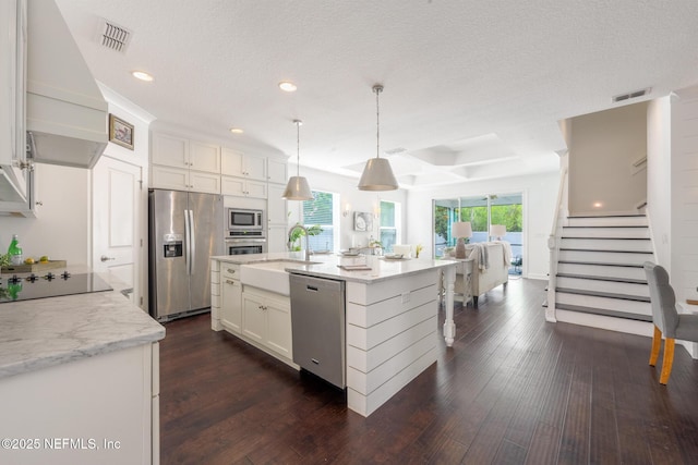 97082 Harbor Concourse Cir, Fernandina Beach, FL 32034 - kitchen featuring appliances with stainless steel finishes, recessed lighting, dark wood-style floors, white cabinetry, and light stone countertops