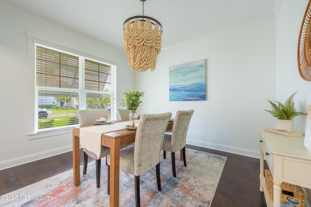 97082 Harbor Concourse Cir, Fernandina Beach, FL 32034 - dining space with a chandelier, dark wood finished floors, and ornamental molding