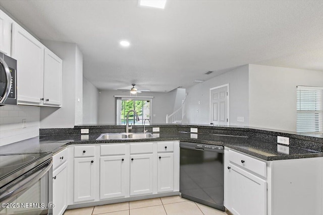 8550 Argyle Business Loop Unit 406, Jacksonville, FL 32244 - kitchen featuring dishwasher, a ceiling fan, white cabinetry, dark stone counters, and light tile patterned floors
