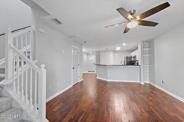 8550 Argyle Business Loop Unit 406, Jacksonville, FL 32244 - unfurnished living room featuring dark wood-type flooring, a ceiling fan, stairway, and recessed lighting