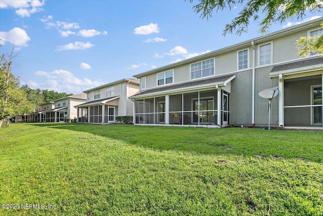 8550 Argyle Business Loop Unit 406, Jacksonville, FL 32244 - back of property with a sunroom, stucco siding, and a yard