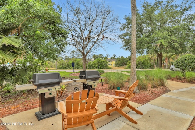 1800 The Greens Way Unit 605, Jacksonville Beach, FL 32250 - view of patio with grilling area
