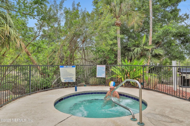 1800 The Greens Way Unit 605, Jacksonville Beach, FL 32250 - view of swimming pool with a community hot tub