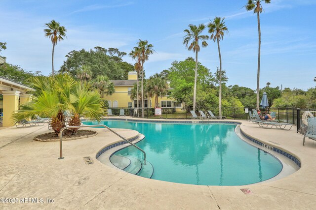 1800 The Greens Way Unit 605, Jacksonville Beach, FL 32250 - community pool with a patio