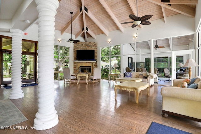 1800 The Greens Way Unit 605, Jacksonville Beach, FL 32250 - living area with ornate columns, a ceiling fan, a wooden ceiling with exposed beams, high vaulted ceiling, and wood-type flooring