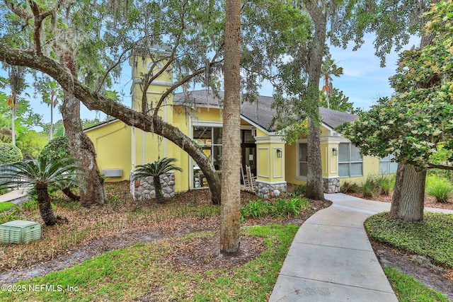 1800 The Greens Way Unit 605, Jacksonville Beach, FL 32250 - mid-century modern home featuring stucco siding and stone siding