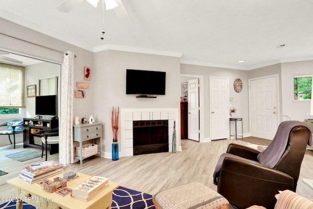 1800 The Greens Way Unit 605, Jacksonville Beach, FL 32250 - living area featuring light wood-style floors, ceiling fan, a fireplace, ornamental molding, and recessed lighting