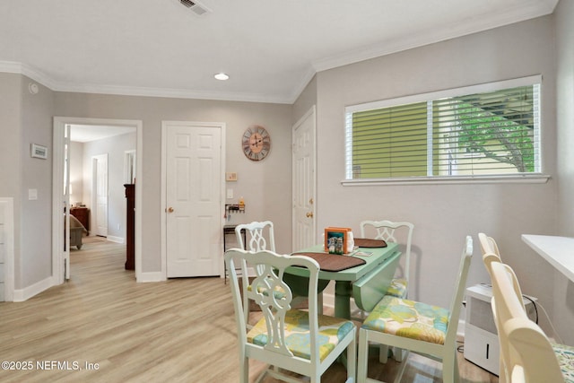 1800 The Greens Way Unit 605, Jacksonville Beach, FL 32250 - dining room with light wood-type flooring, ornamental molding, and recessed lighting